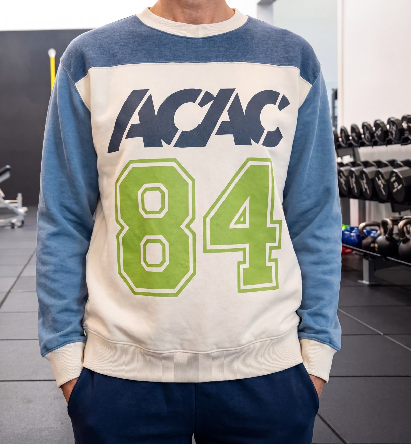 An acac member in the Club 84 colorblock crewneck