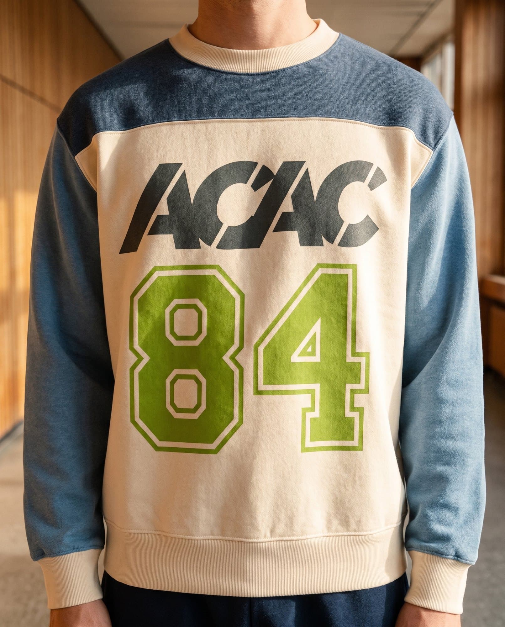 An acac member in the Club 84 colorblock crewneck