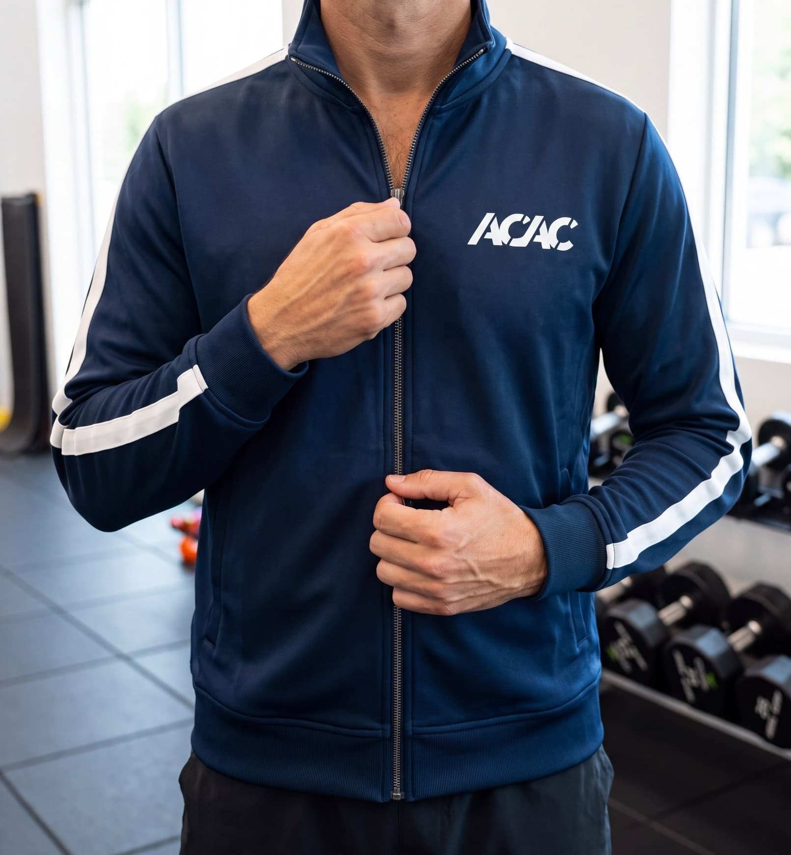 An acac member in the Club 84 striped track jacket